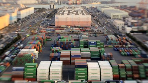 Japan - March 2011: High elevation time lapse view of traffic and commercial activity at a busy Japanese Cargo Container Port in Odaiba, Tokyo, Japan in March, 2011