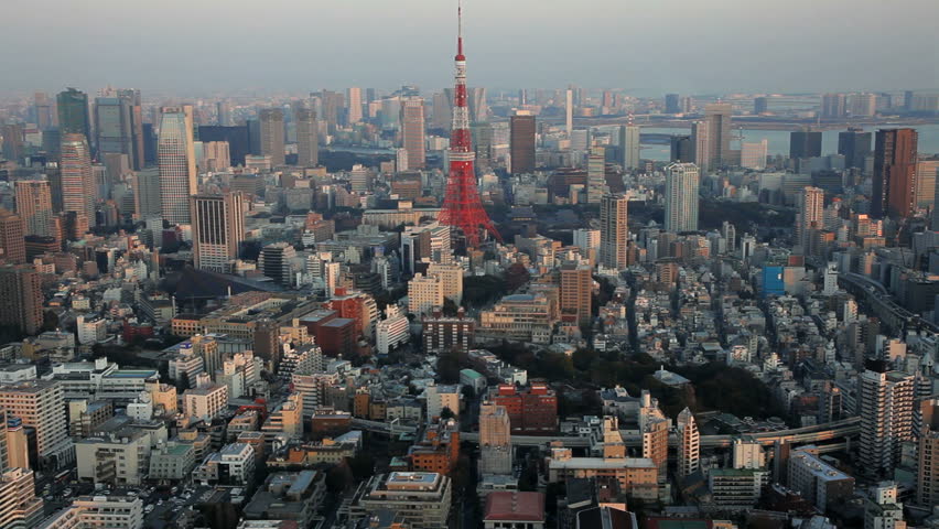 Aerial urban landscape view of Tokyo with skyscrapers, river, and Tokyo Tower, Japan
