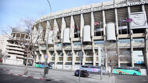 MADRID - MARCH 8: Several buses stand near Santiago Bernabeu stadium on 8 March 2012 in Madrid, Spain. Stadium was built in 1947, is named after mud Real Madrid president Santiago Bernabeu.