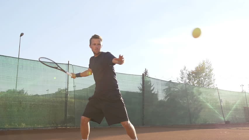 Slow Motion Shot Of A Professional Tennis Player Hitting Forehand With Tennis