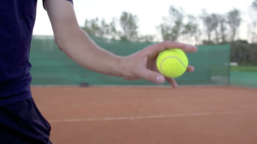 Slow Motion Shot Of A Professional Tennis Player Throwing And Catching A Tennis