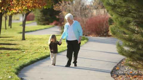 Grandmother and granddaughter in the park 