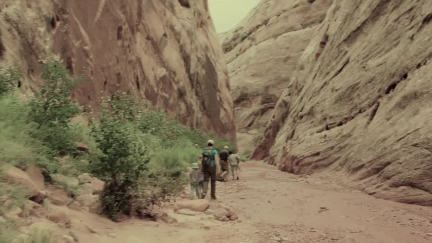A family walking the pioneer register in Capitol Reef National Park