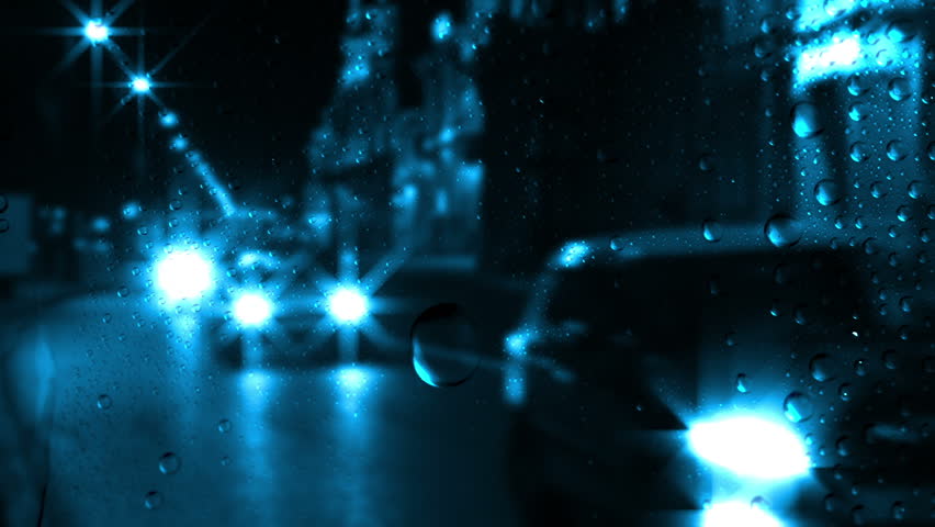 Night. City traffic. Outside the window the rain. Rain drops on the glass