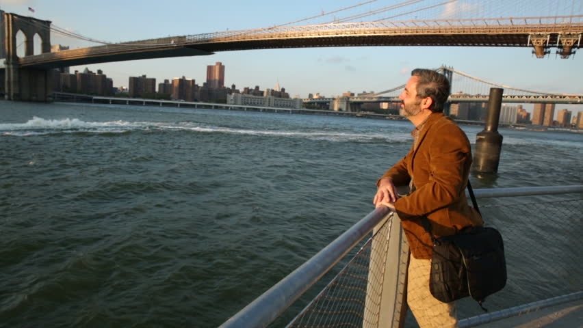 Man enjoying New York waterside view 