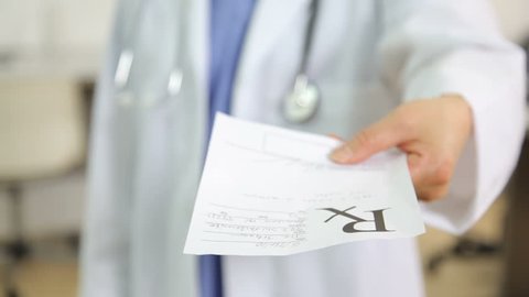 Doctor giving a prescription, close up 库存视频