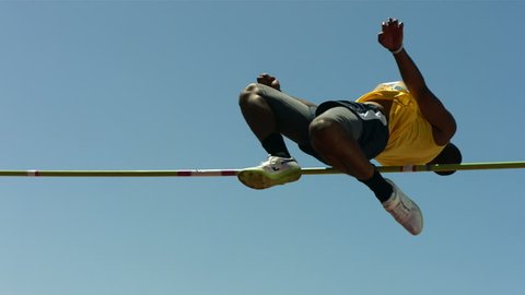 Track and Field athlete doing pole vault, slow motion