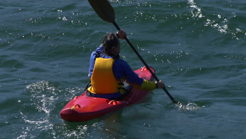 A man in kayak in Lake Como