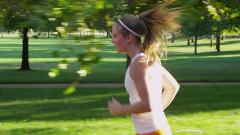 Healthy young woman jogging in park