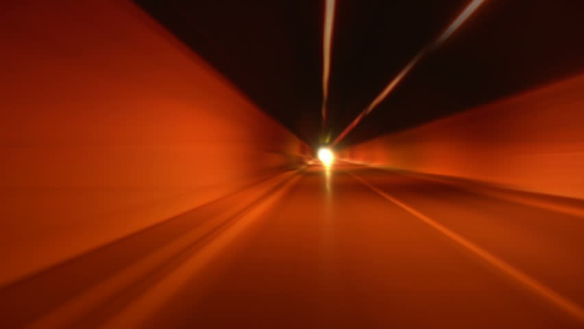 Driving through tunnel, abstract with motion blur and glow.