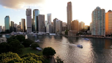 Australia - April 2012: Brisbane cityscape with river and water taxi at sunset in Brisbane, Queensland, Australia, April, 2012