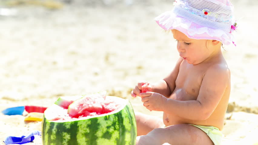 Baby is eating watermelon