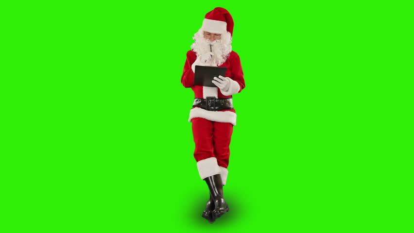 Santa Claus taking notes on a clipboard and sitting, Green Screen