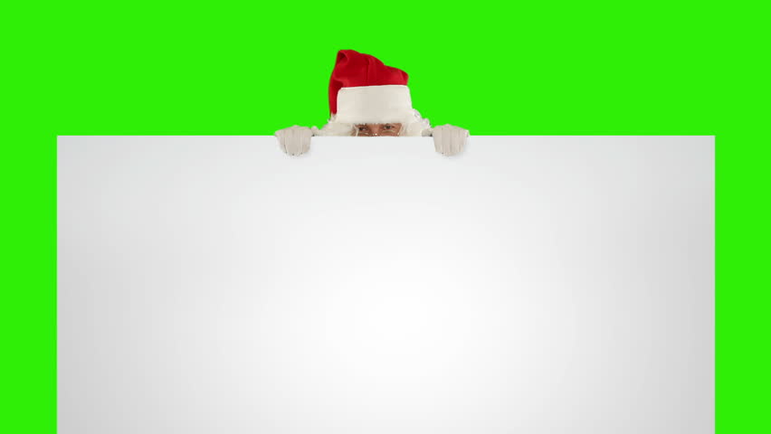 Santa Claus appears behind a white sheet with space for tex, Green Screen