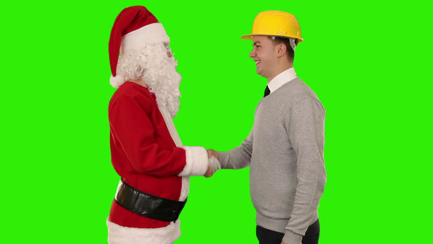 Santa Claus and Young Architect shaking hands and looking at camera, Green