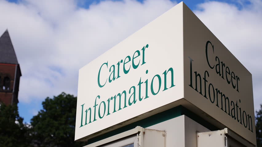 A time lapse shot of a career information sign on a college campus.