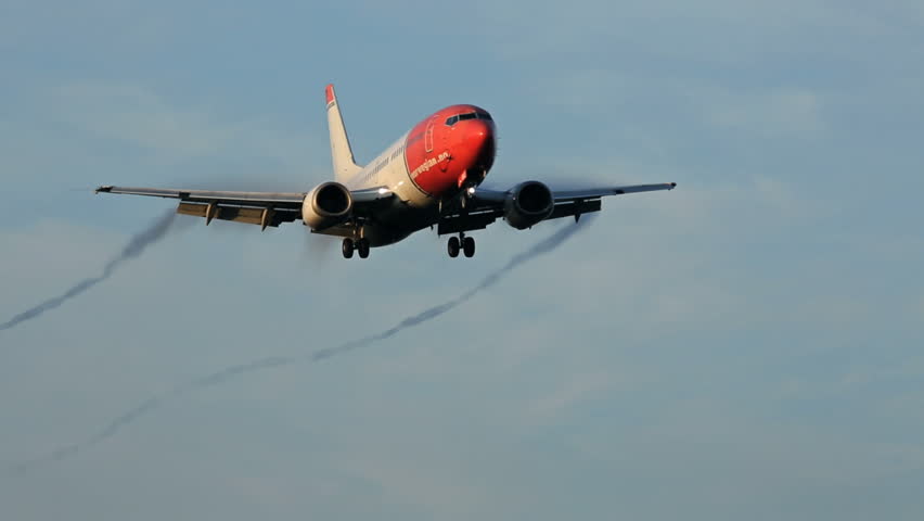 OSLO AIRPORT 10 SEPT 2013: Norwegian airplane flying overhead for landing at
