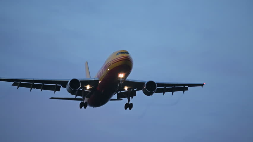 OSLO AIRPORT 14 SEPT 2013: DHL freight airplane flying overhead for landing at