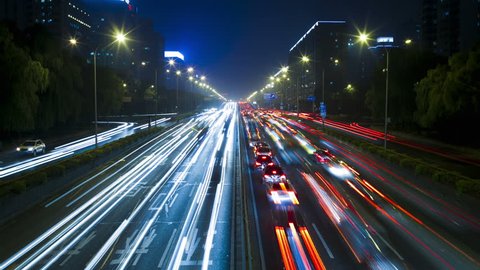 TIME LAPSE HD, the light trails of city traffic on the building background in Beijing china Stock Video