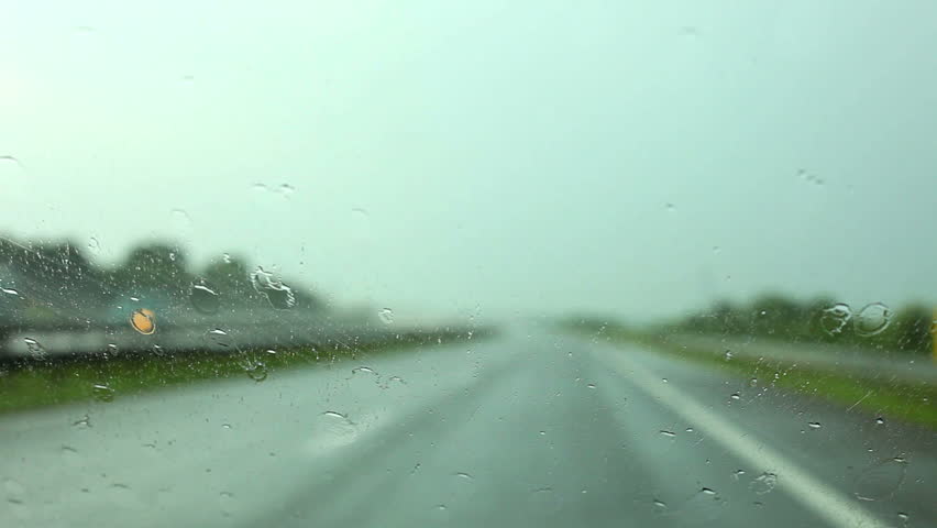 Car driving and Rain drops on the glass