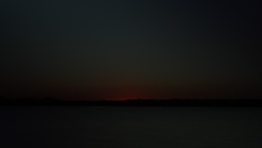 Timelapse of a Fiery sunrise over a Colorado Lake. HD 1080p