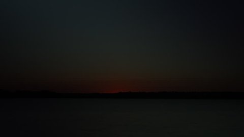Timelapse of a Fiery sunrise over a Colorado Lake. HD 1080p