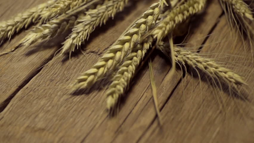 golden wheat on the old wooden background