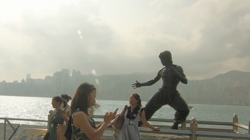 HONG KONG - SEPTEMBER 12: Statue of Bruce Lee, a Kung Fu Hero icon. Hyperlapse