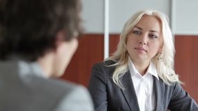 Friendly employer interviewing a potential candidate for a position in the company
