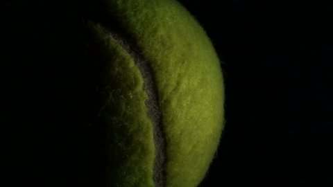 Tennis ball against black loop