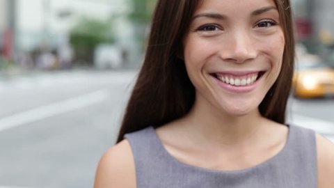 Business woman portrait - casual in New York, Happy smiling young Asian female professional outdoor portrait closeup in New York City, Manhattan