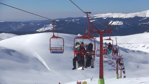 ROMANIA, BUCEGI, FEBRUARY 2,  2013, People Riding with Chairlift in Alps, Alpine View, Winter Sports, Skiing Slope