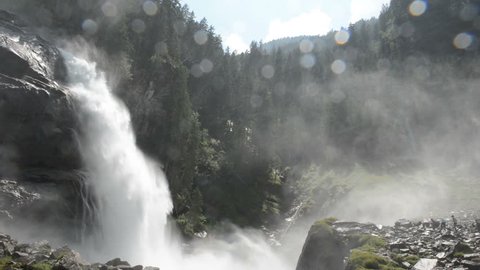 KRIMML, AUSTRA – JULY 17: People visiting the Krimml Waterfalls as part of High Tauern National Park. The Krimml Waterfalls has a total height of 380 meters. Located at Krimml on July 17, 2013