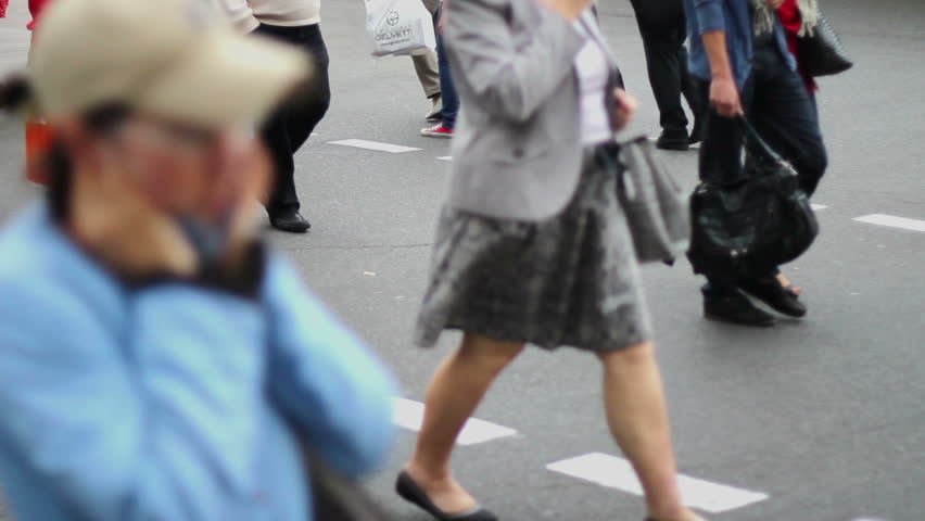 Business people walk on crossroad pedestrians, city daytime