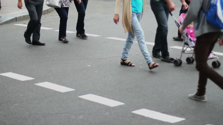Casual dressed people walk on crossroad pedestrians city daytime
