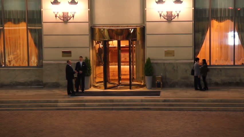 Elite 5-star hotel entrance at night timelapse visitors come out Royalty-Free Stock Footage #4692896