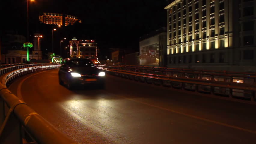 Cars drive by road junction bridge part urban city night