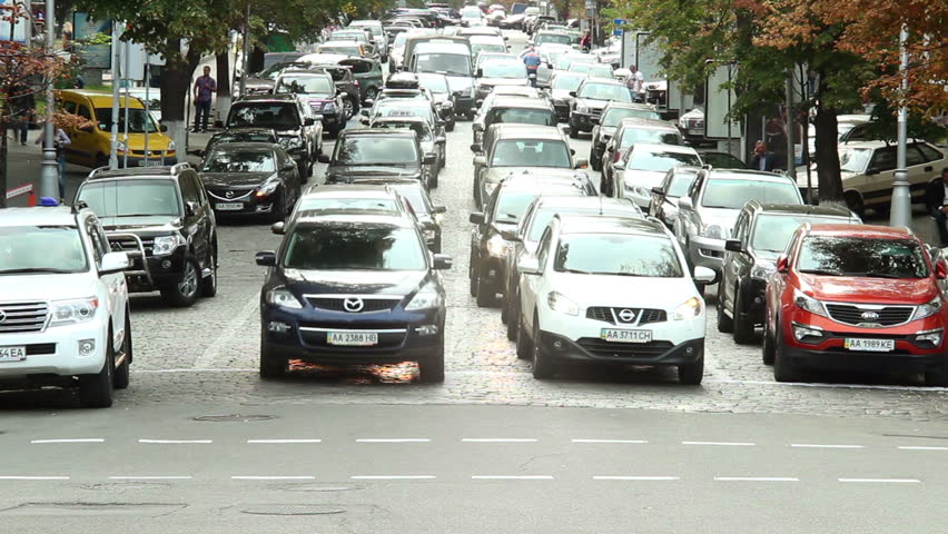 City crossing in rush hour, people mass cross road, cars