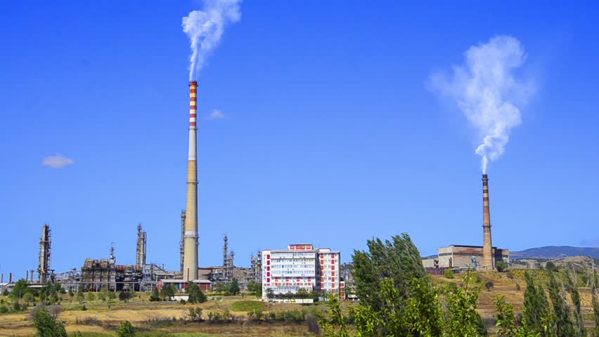 Fumes big power plant oil refinery - Stock Video. big chimney with grey smoke