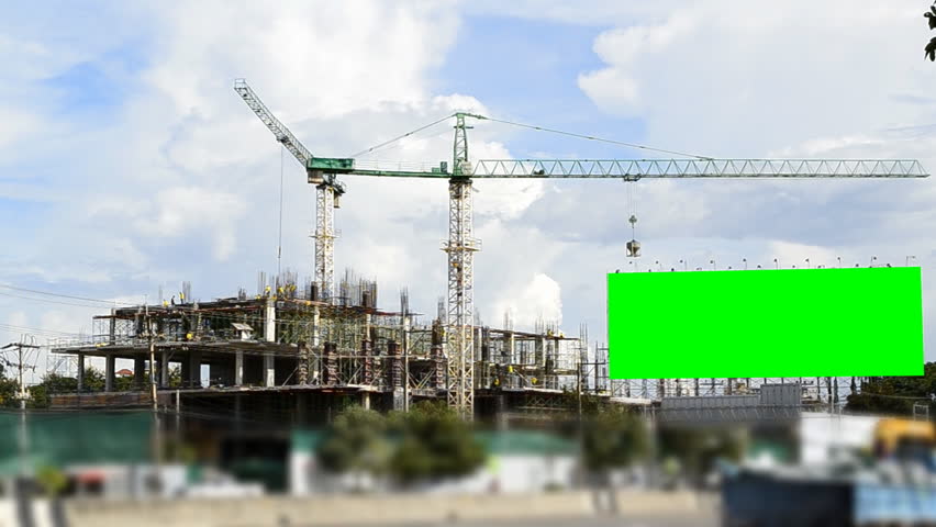 big green screen billboard and construction site