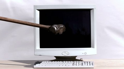 Smashing a computer with sledge hammer