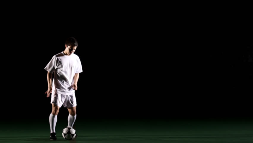 Isolated Soccer Player On Black Stock Footage Video (100% Royalty-free