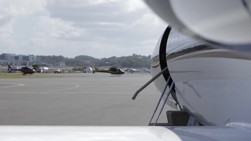 Left to right closeup pan shot of a Cessna Citation VII closing its door. Shot on a 5D MK II with a Canon 70-200mm f2.8 zoom lens.