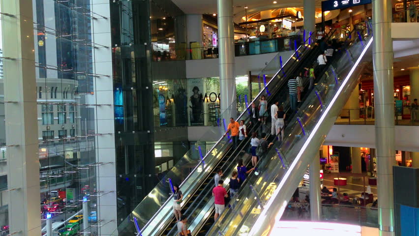 BANGKOK - 10 SEPTEMBER: People are taking escalators in a shopping mall,
