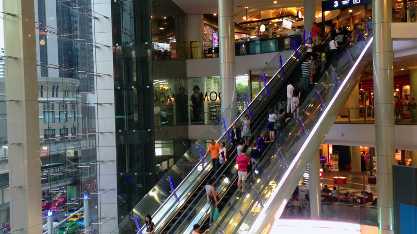 BANGKOK - 10 SEPTEMBER: Timelapse view of people are taking escalators in a