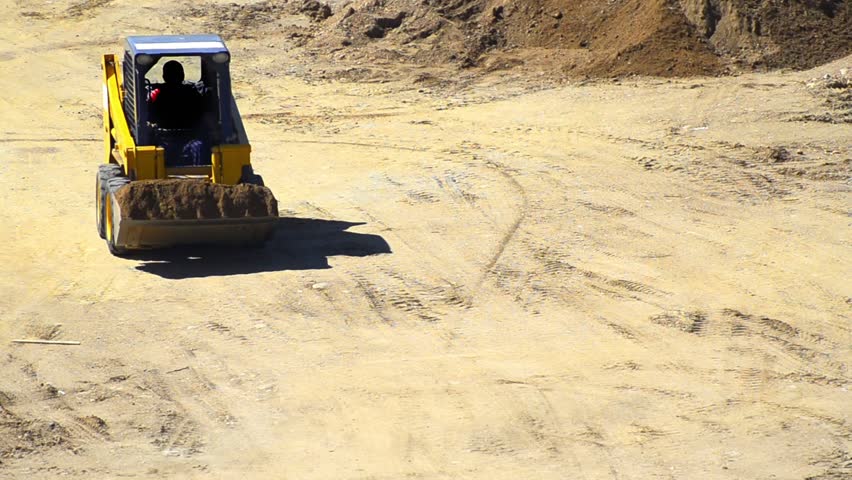 Bulldozer - Stock Video. A bulldozer pushing dirt.