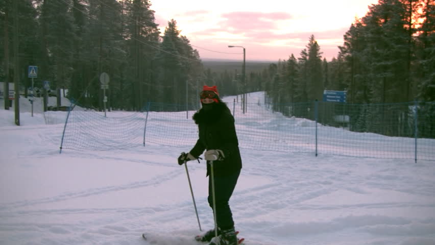 The woman (which not so is confidently rolled on a ski) is lowered on a slope