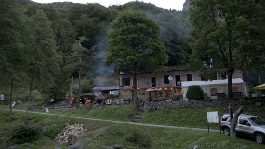 Hidden restaurant in Locarno, Switzerland.  Charcoal fire cooking food. | Shutterstock HD Video #4722032