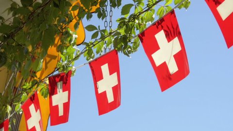 Swiss flag flapping in the summer sun.
