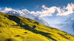 Time lapse clip. Alpine meadows at the foot of Tetnuldi glacier. Upper Svaneti, Georgia, Europe. Caucasus mountains. Beauty world. HD video (High Definition).